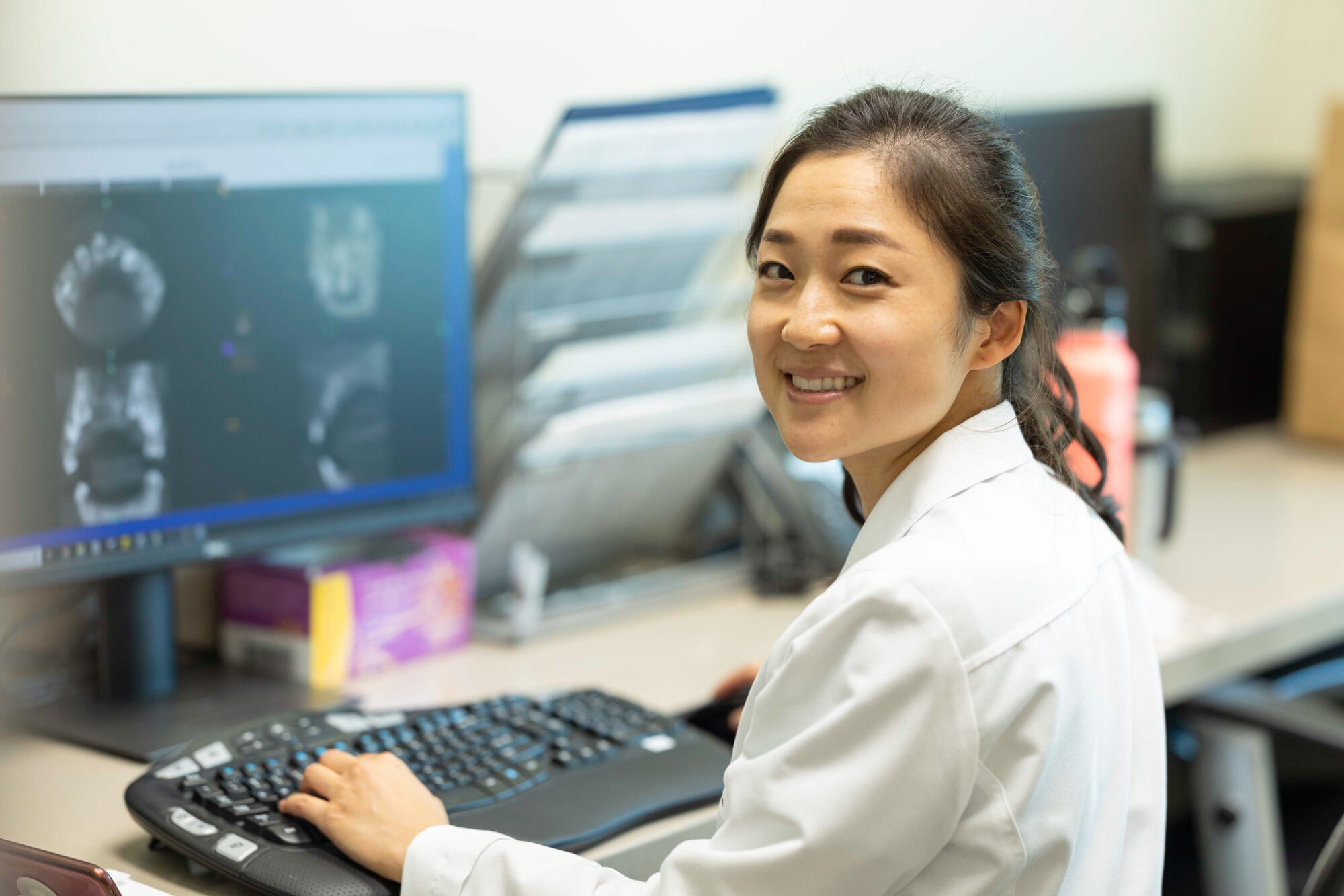 Dr. Lili creating a beautiful smile with clear aligners.